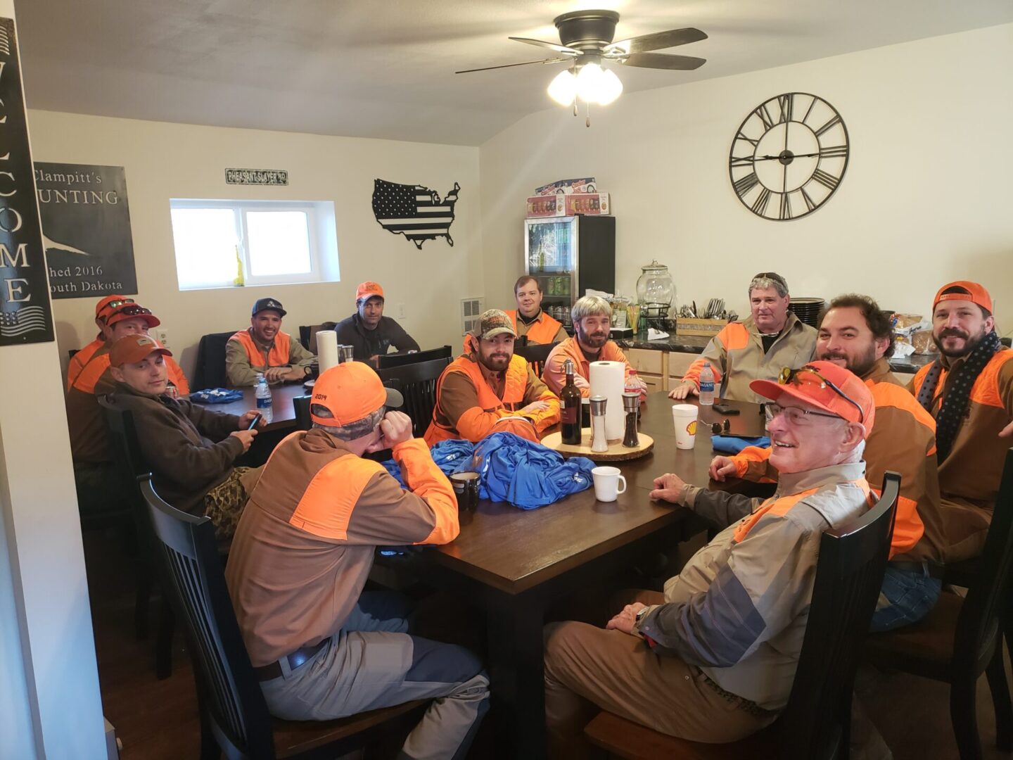 a group of men sitting around a table