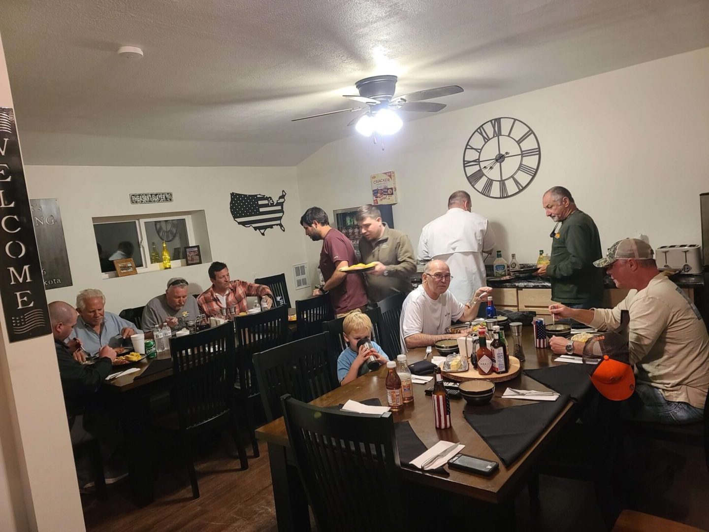 a group of people eating at tables