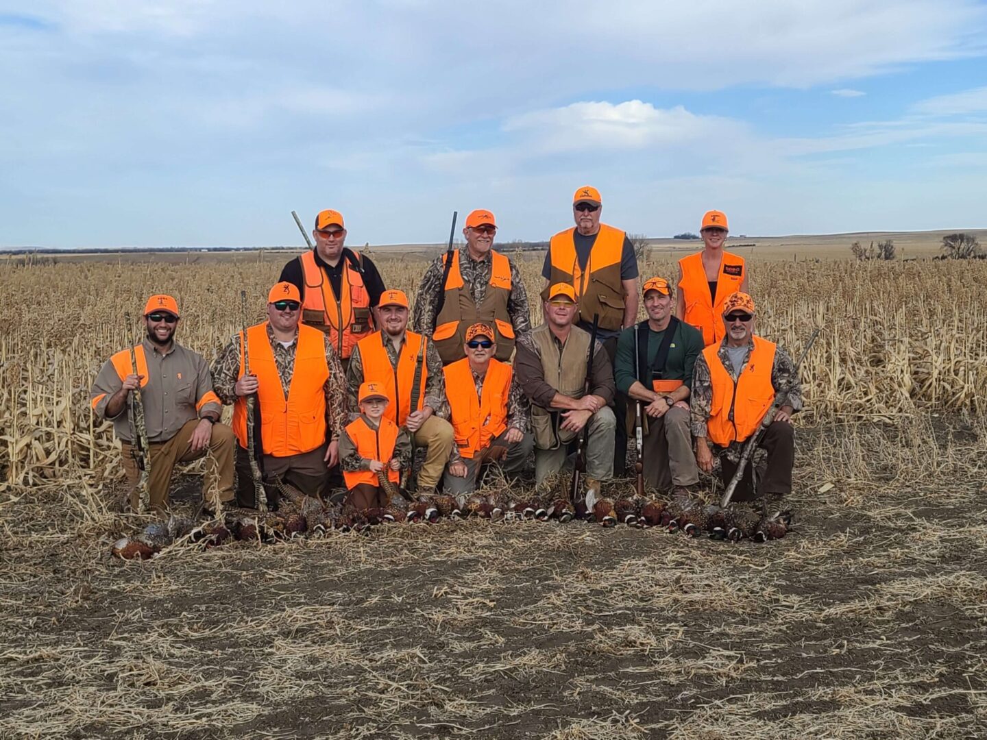 a large group of men in a pheasant hunting ground