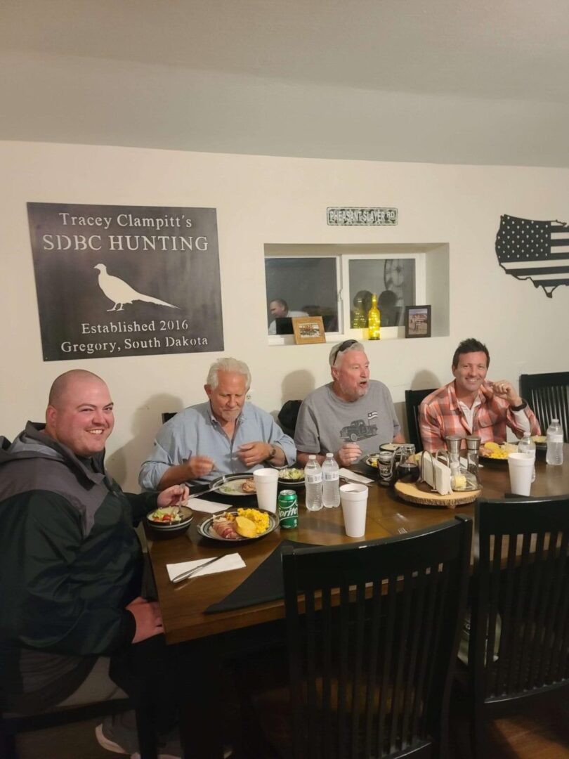 men sitting and eating at a table