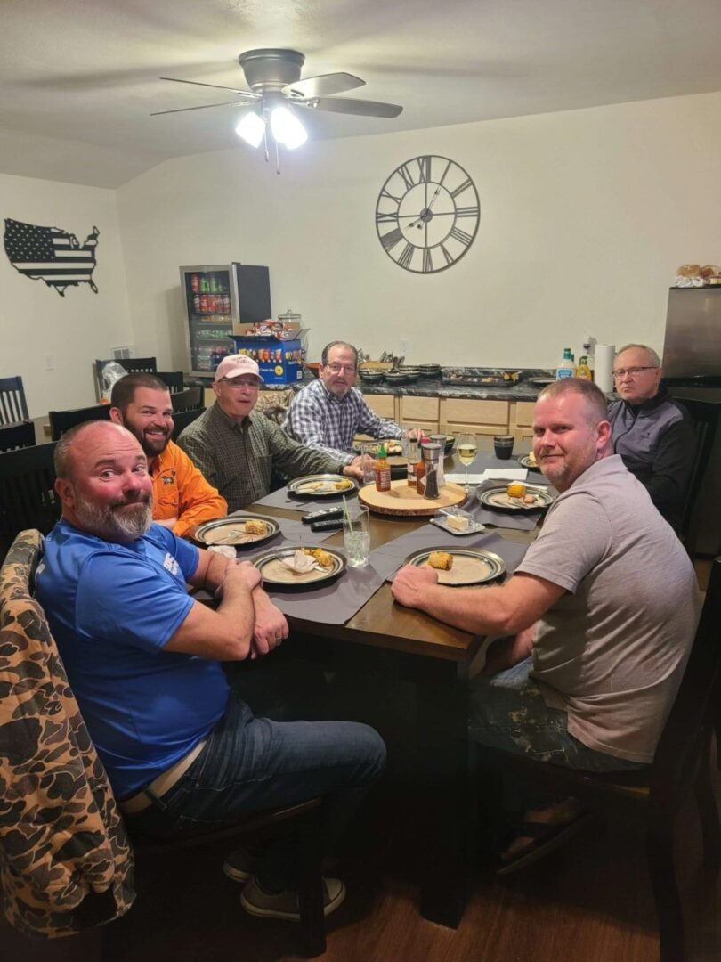 men eating at a table