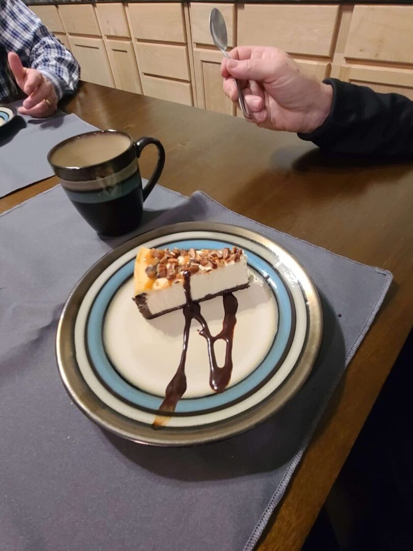 a mug and cheesecake on a plate