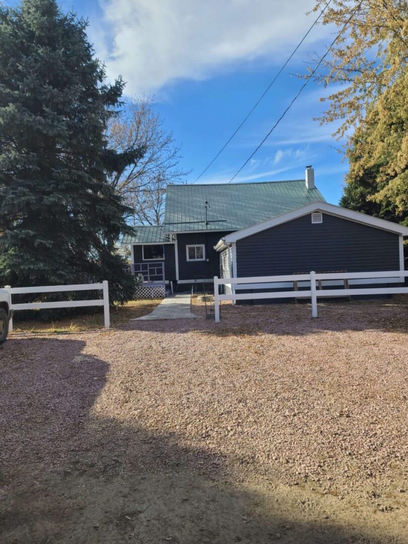 front yard of a blue house