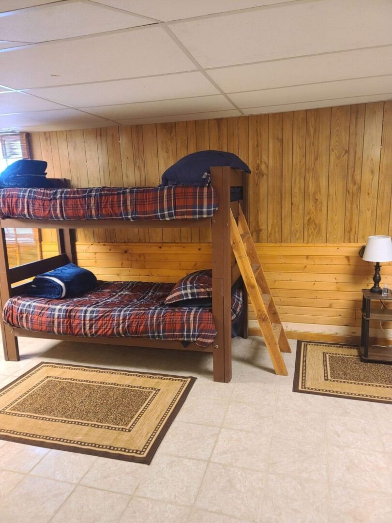 a bunk bed with plaid sheets 2