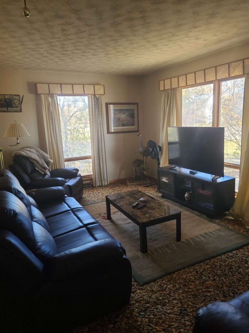 a living room with a flat screen TV