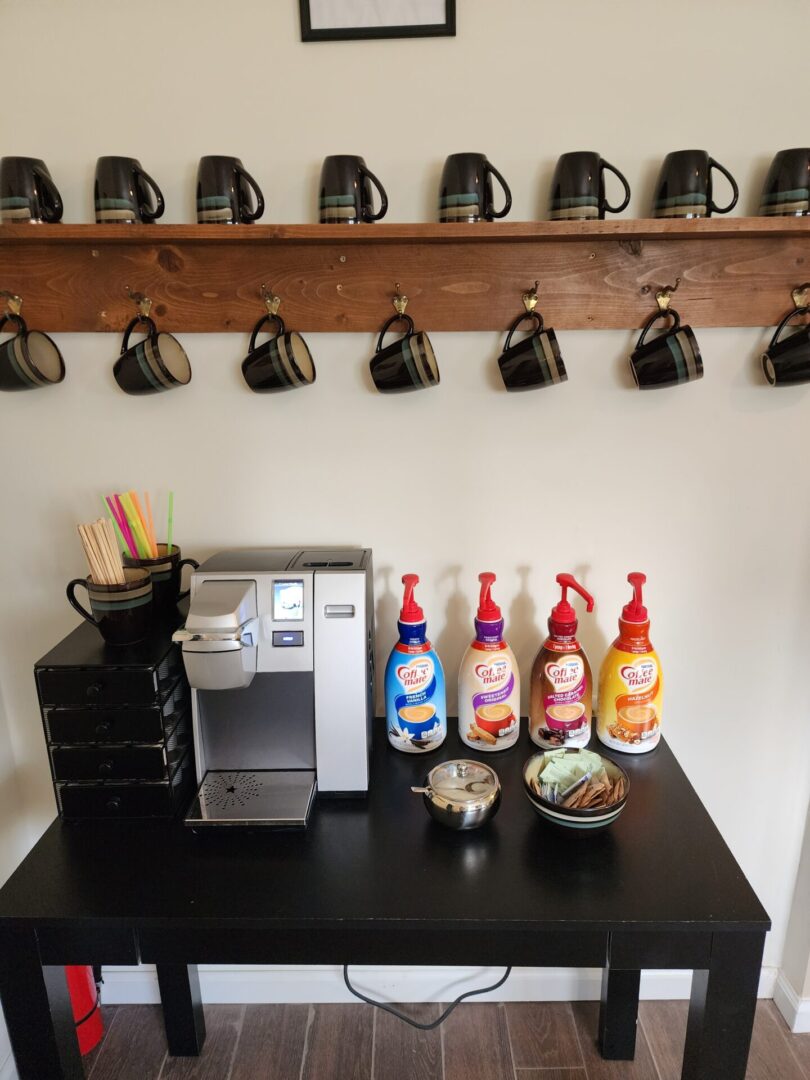 Coffee Machine and Tea Cups on Wooden Table