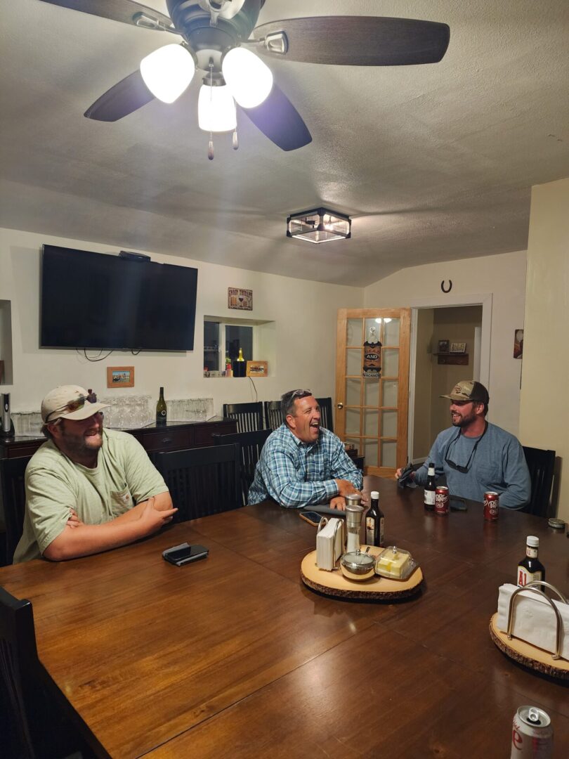 Hunting Team Sitting on Wooden Dining Table