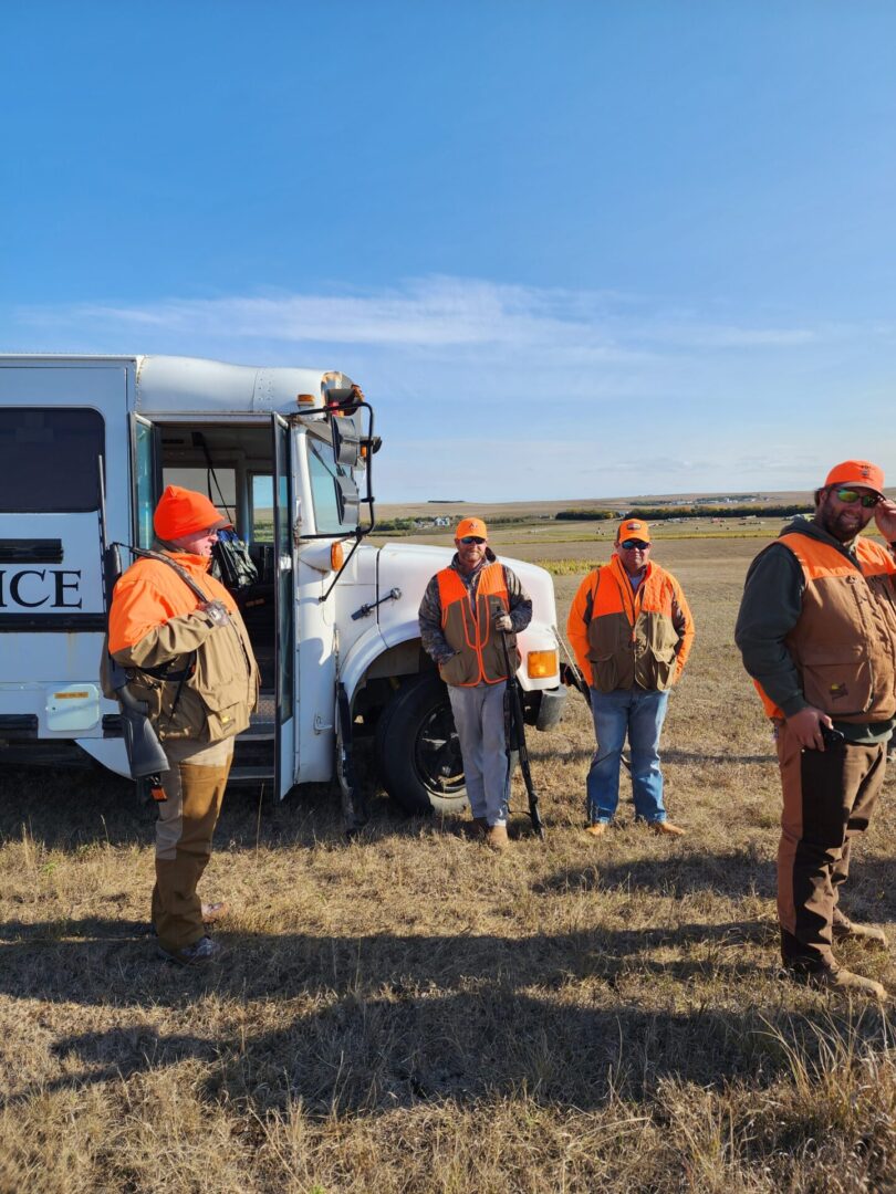 Hunters On The Field With Truck