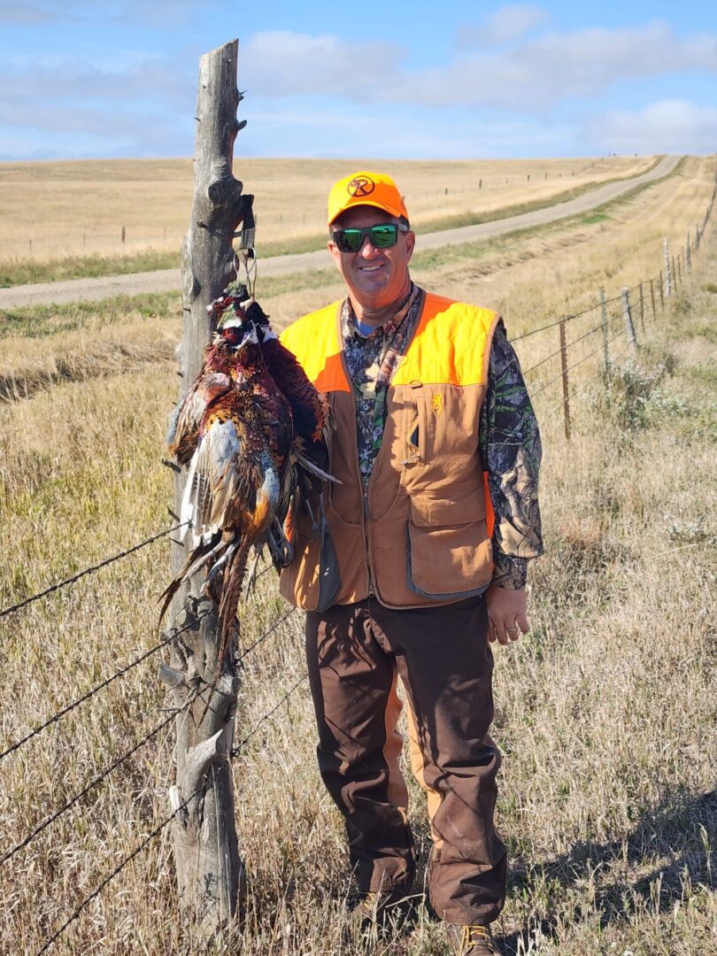 The Hunting Man with Bird at Field