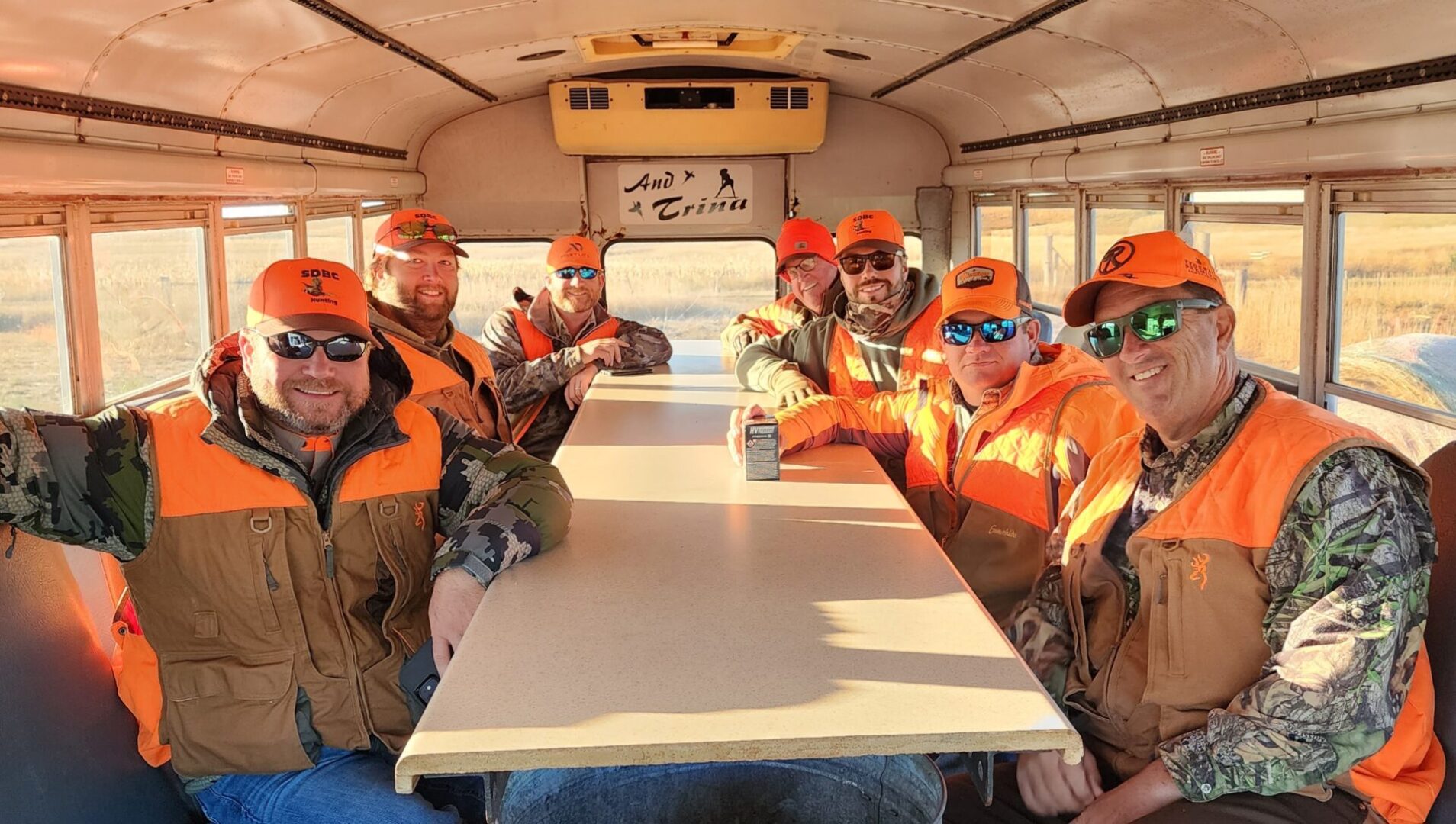 Group of Hunters Sitting on Inside of The Truck