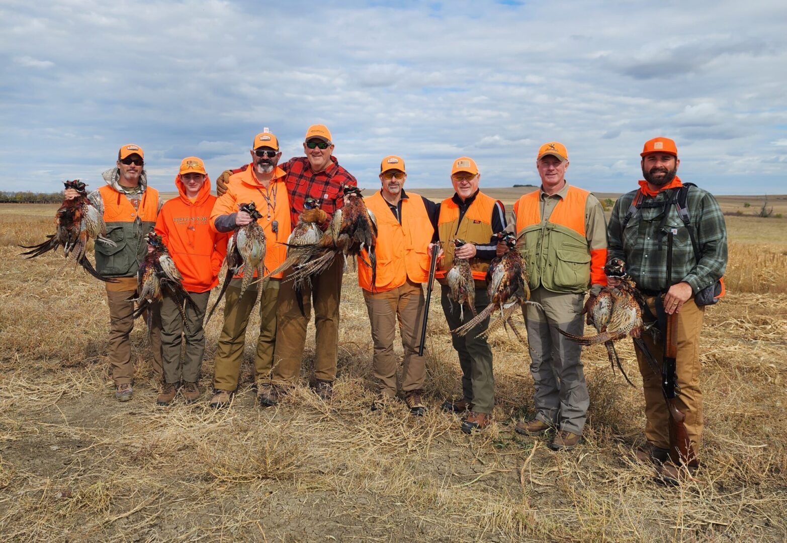 Hunters Holding Birds at Hunting Field