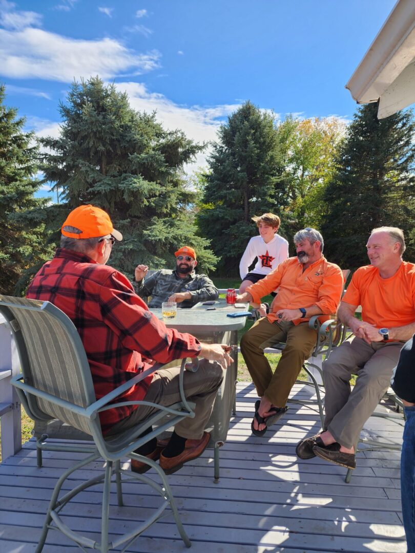 Hunting Team Having a Food at Outdoor