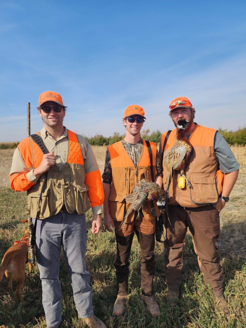 Three Hunters with Birds and Dogs