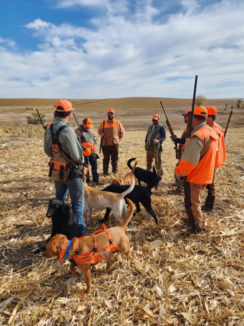 Hunters Team On The Field With Dog