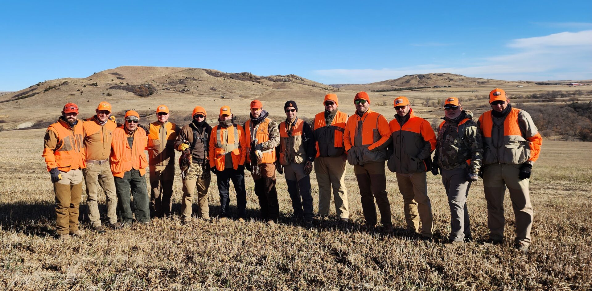 The Group of Hunters on The Field