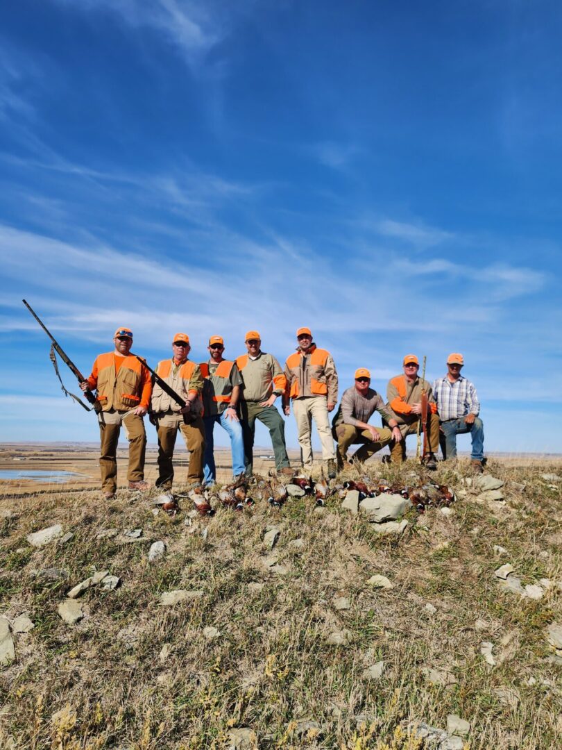 Group of People at Hunting Field With Guns