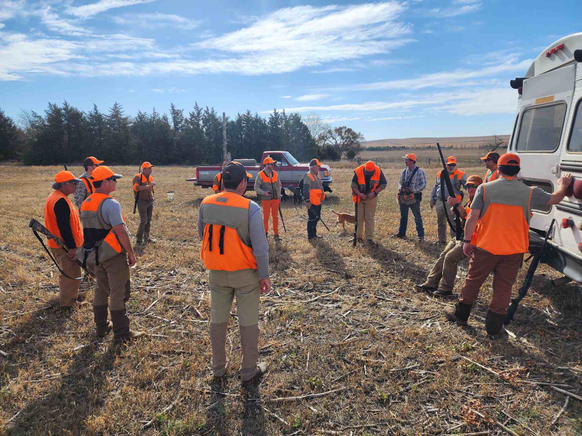 a team of hunters with their guns