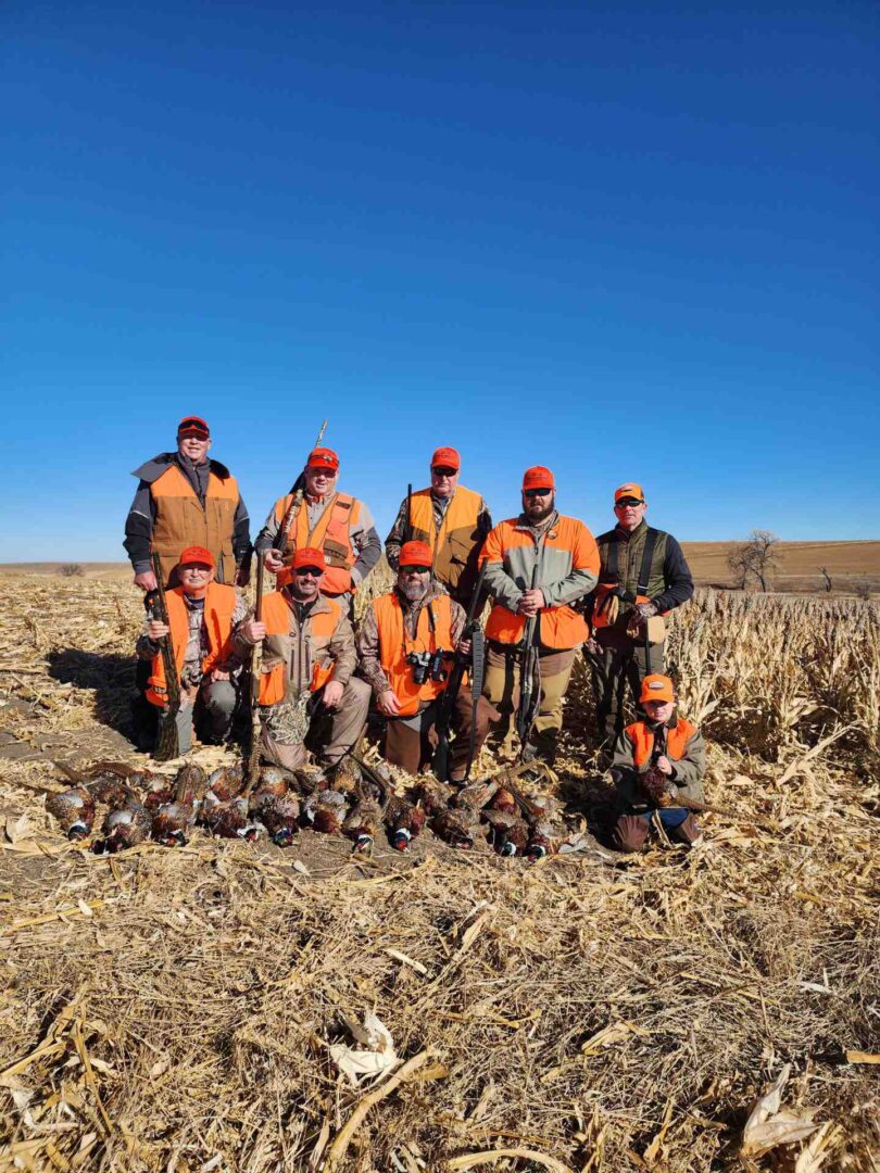 A group of hunters with guns and the hunt animals